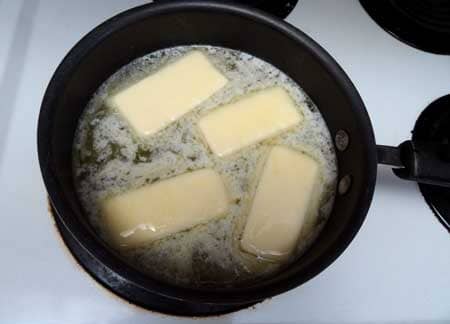 Add butter to the water on the stovetop for this cannabutter recipe